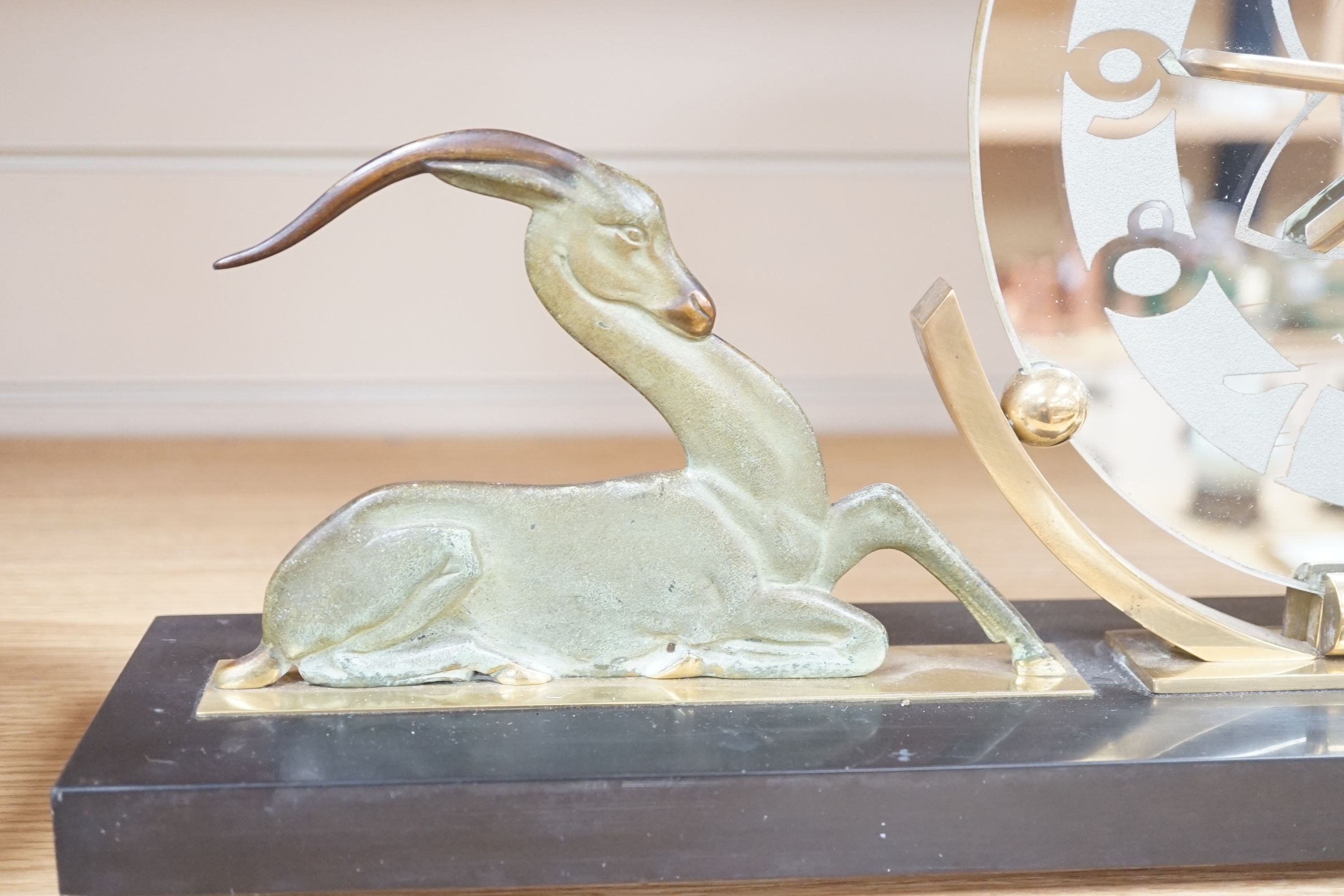 An Art Deco bronze and black slate ‘antelope’ mantel timepiece, 62cm